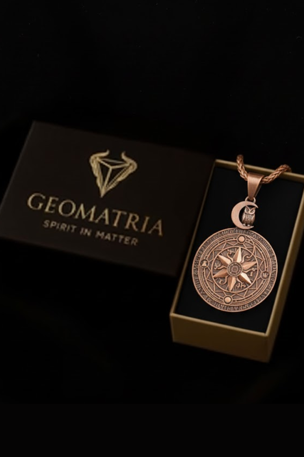 A pendant necklace with a circular medallion and a box with the Geomatria logo.