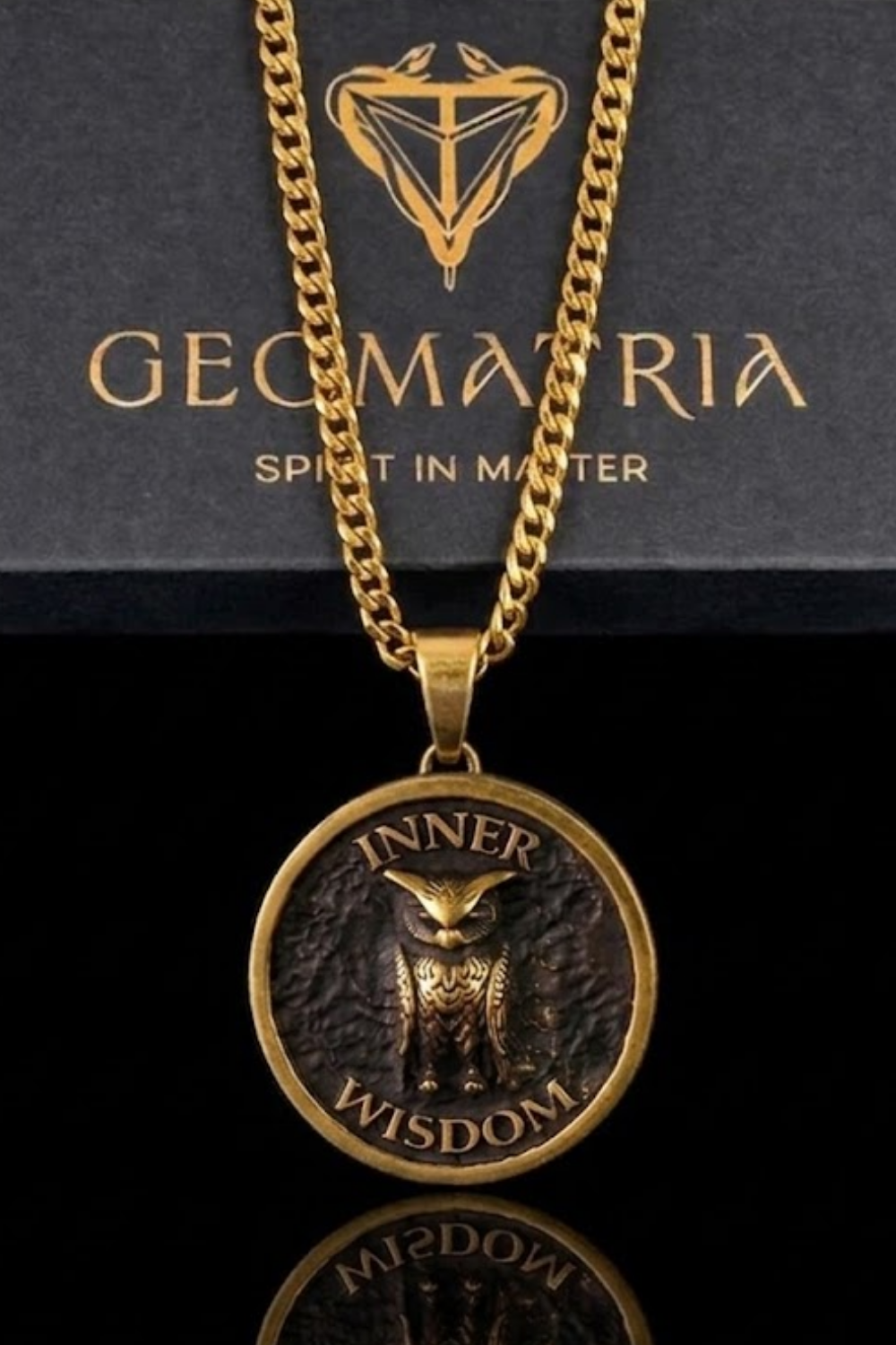A gold-colored necklace with a pendant featuring an owl and the words " Inner Wisdom" engraved on it.
