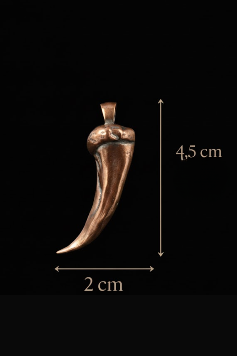 A copper-colored pendant in the shape of a stylized fish or sea creature, with dimensions provided in centimeters.