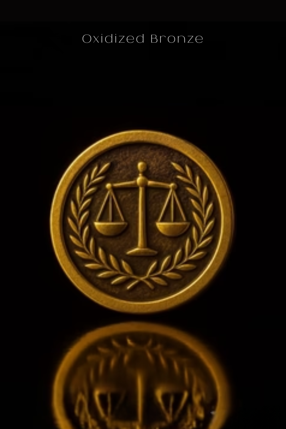 a golden emblem with a scale of justice, surrounded by a laurel wreath, against a black background.
