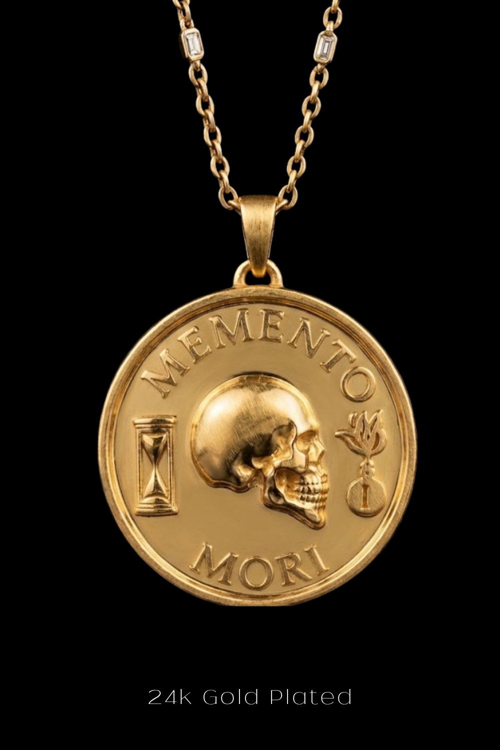 A 24k gold plated necklace with a pendant featuring a skull and the Latin phrase "Memento mori" (which means "Remembering the dead" in English).
