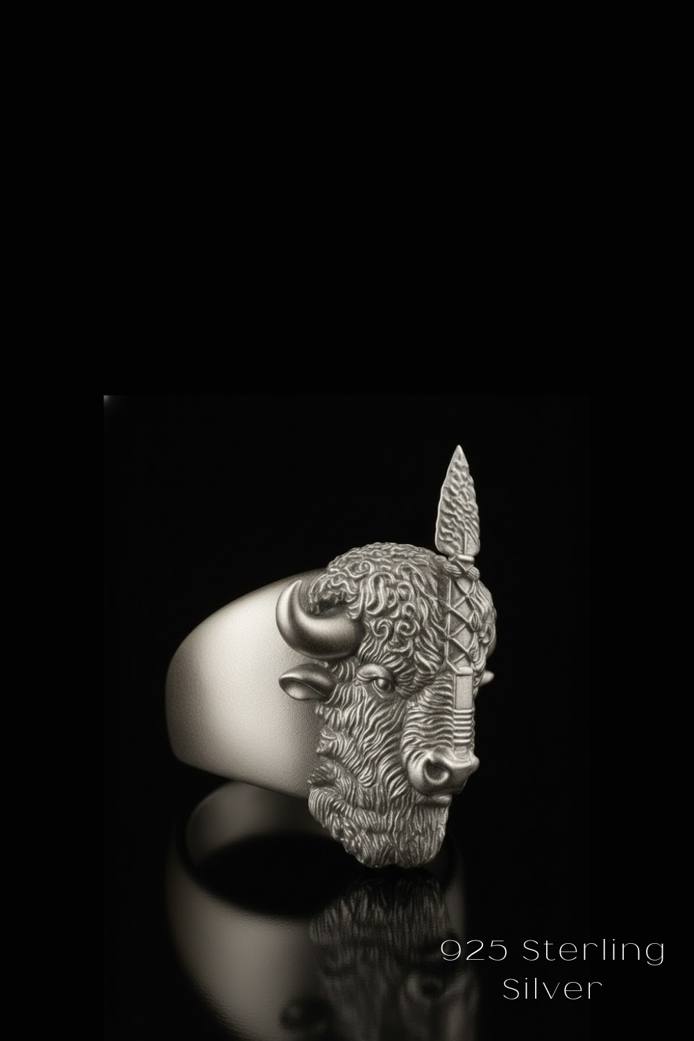A silver ring featuring a detailed buffalo head design against a black background.