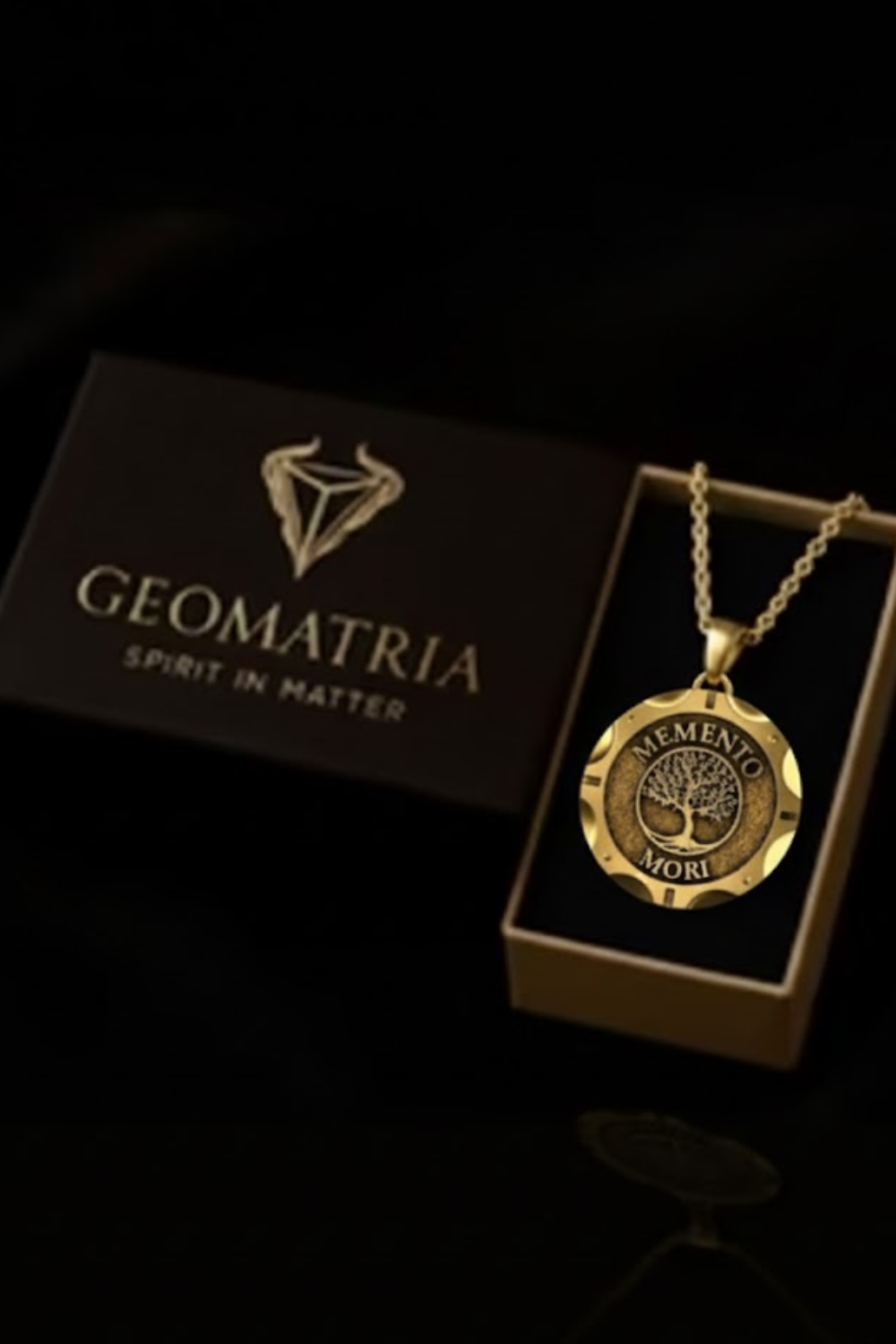 a necklace with a pendant, placed inside a box with a logo, and a tree-like emblem on the box.