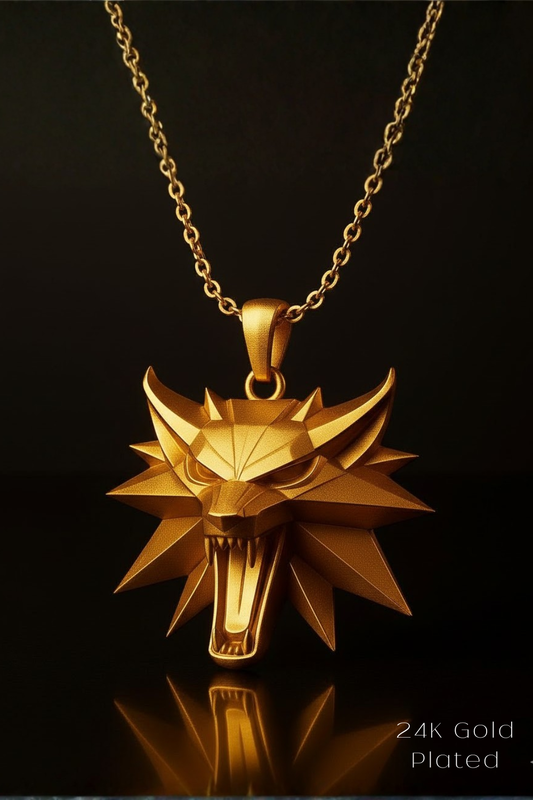 A gold-colored pendant necklace with a stylized wolf head design at the center, set against a dark background.