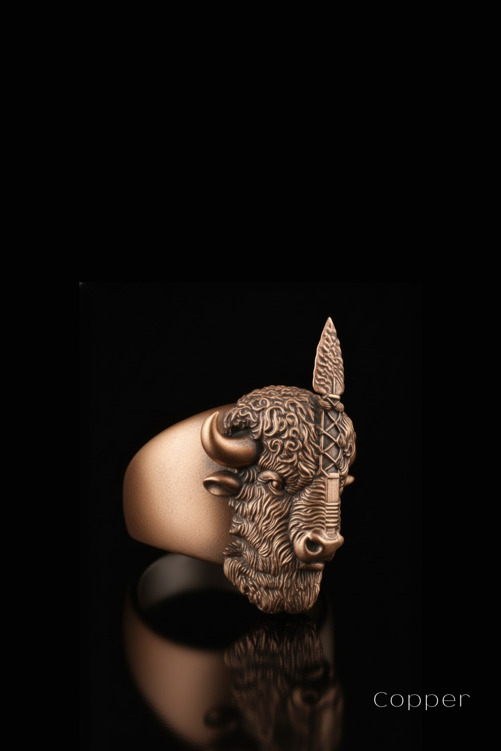 A copper ring featuring a detailed, sculpted buffalo head design.