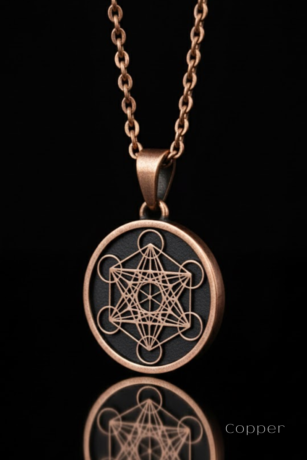 A copper-colored pendant necklace with a circular design featuring a geometric pattern.