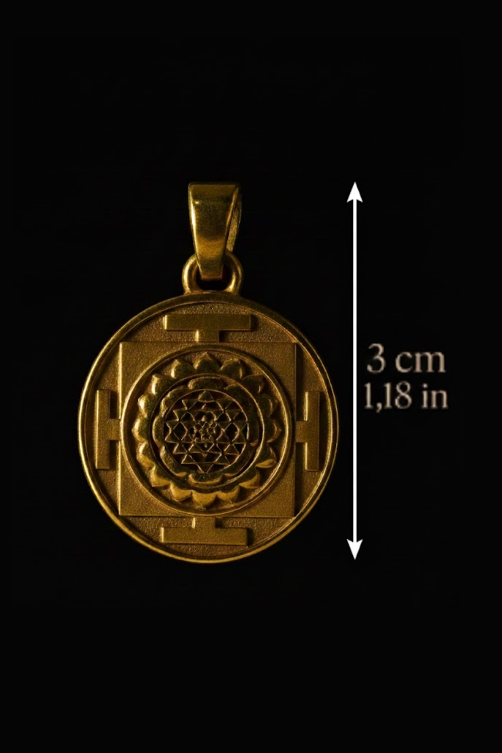 A gold-colored pendant with a detailed design, possibly a symbol or medallion, is shown against a black background.