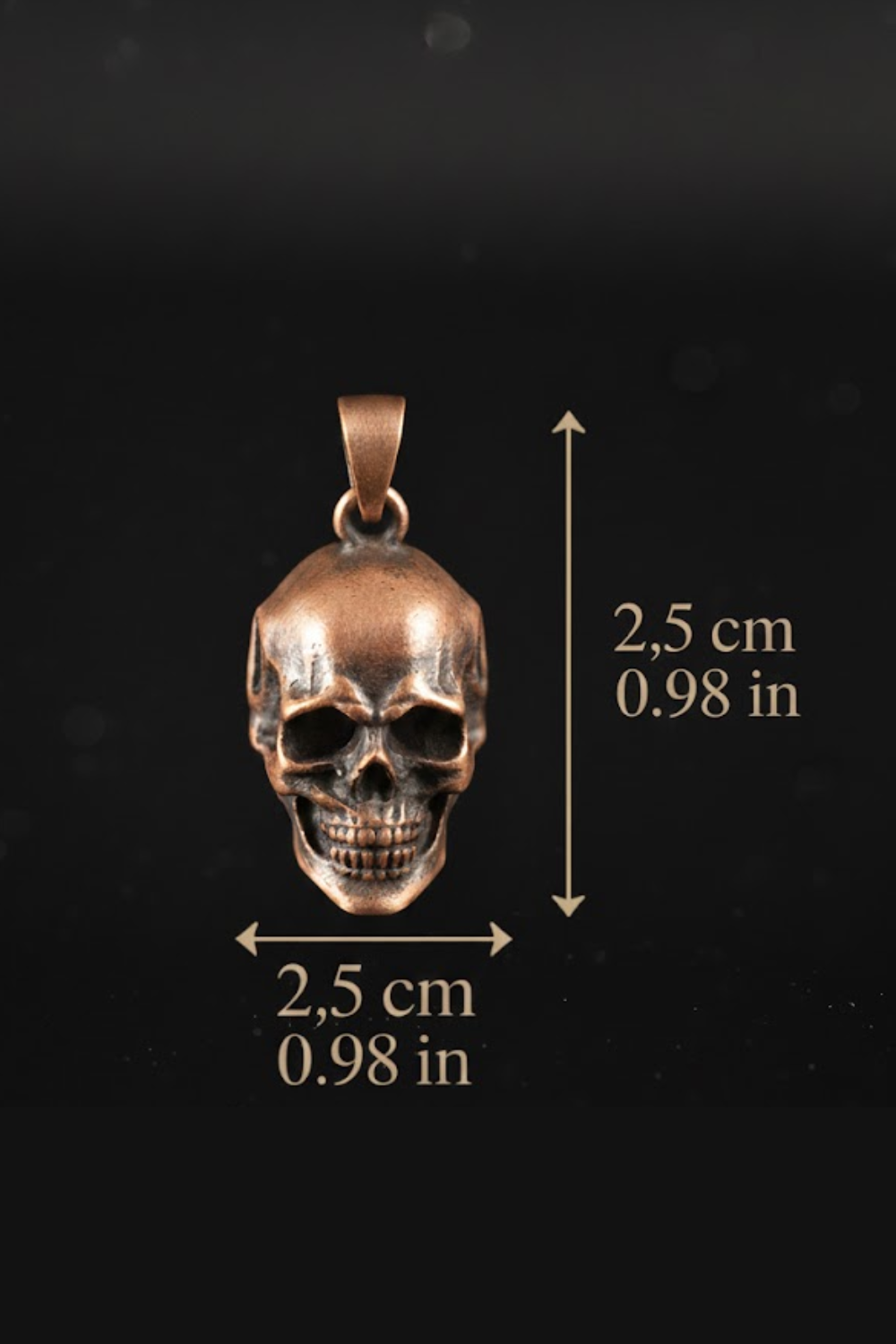 A close-up image of a pendant in the shape of a skull, with measurements provided.