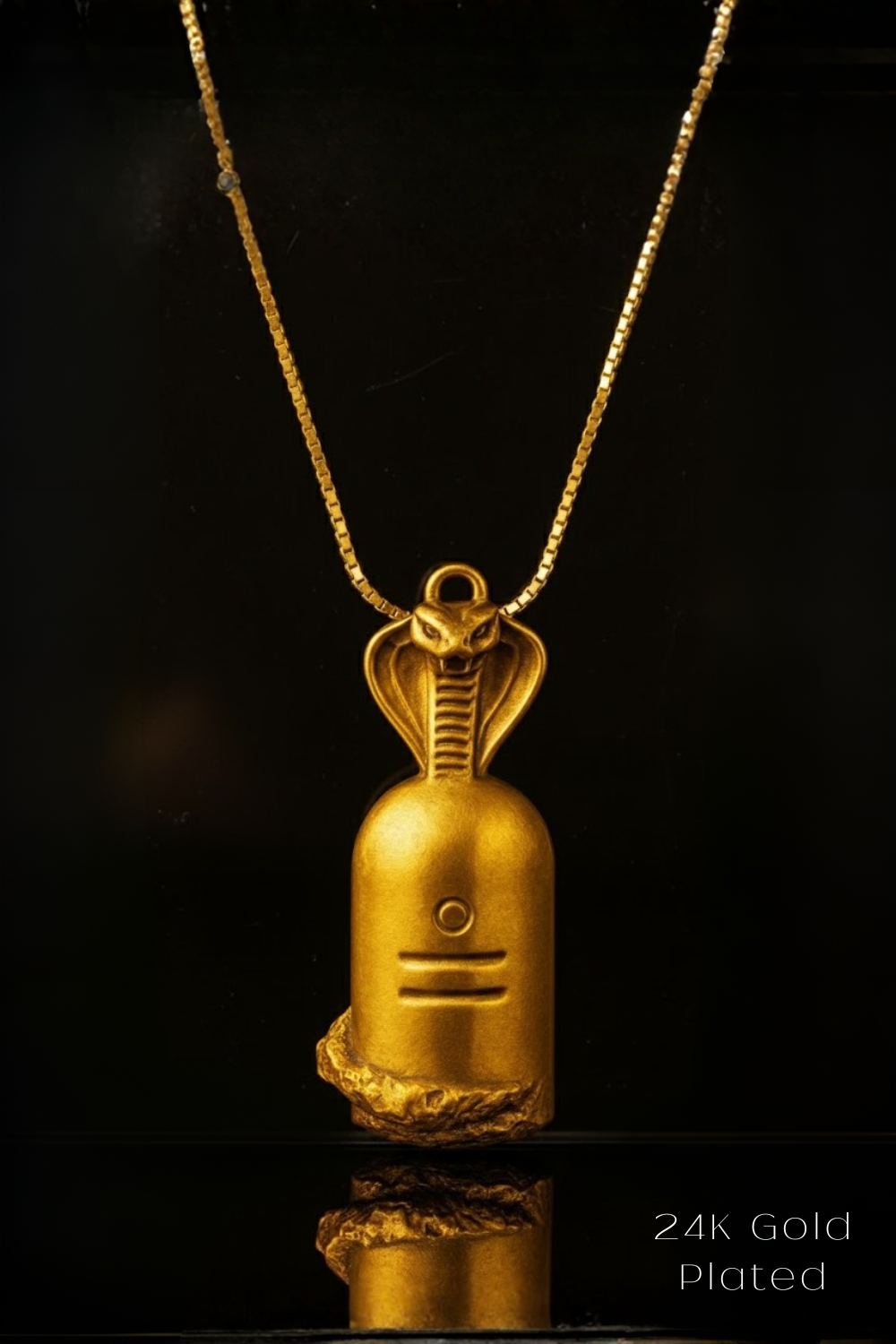 A 24K gold-plated pendant necklace with a snake design on a black background.