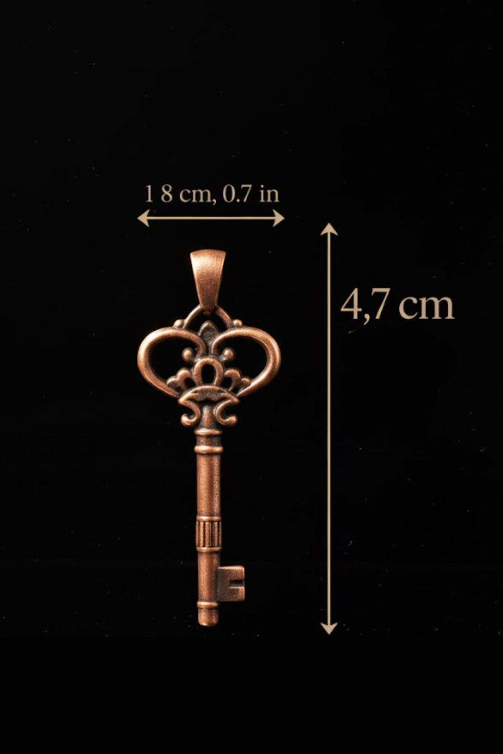 a detailed view of a small, ornate key against a black background.