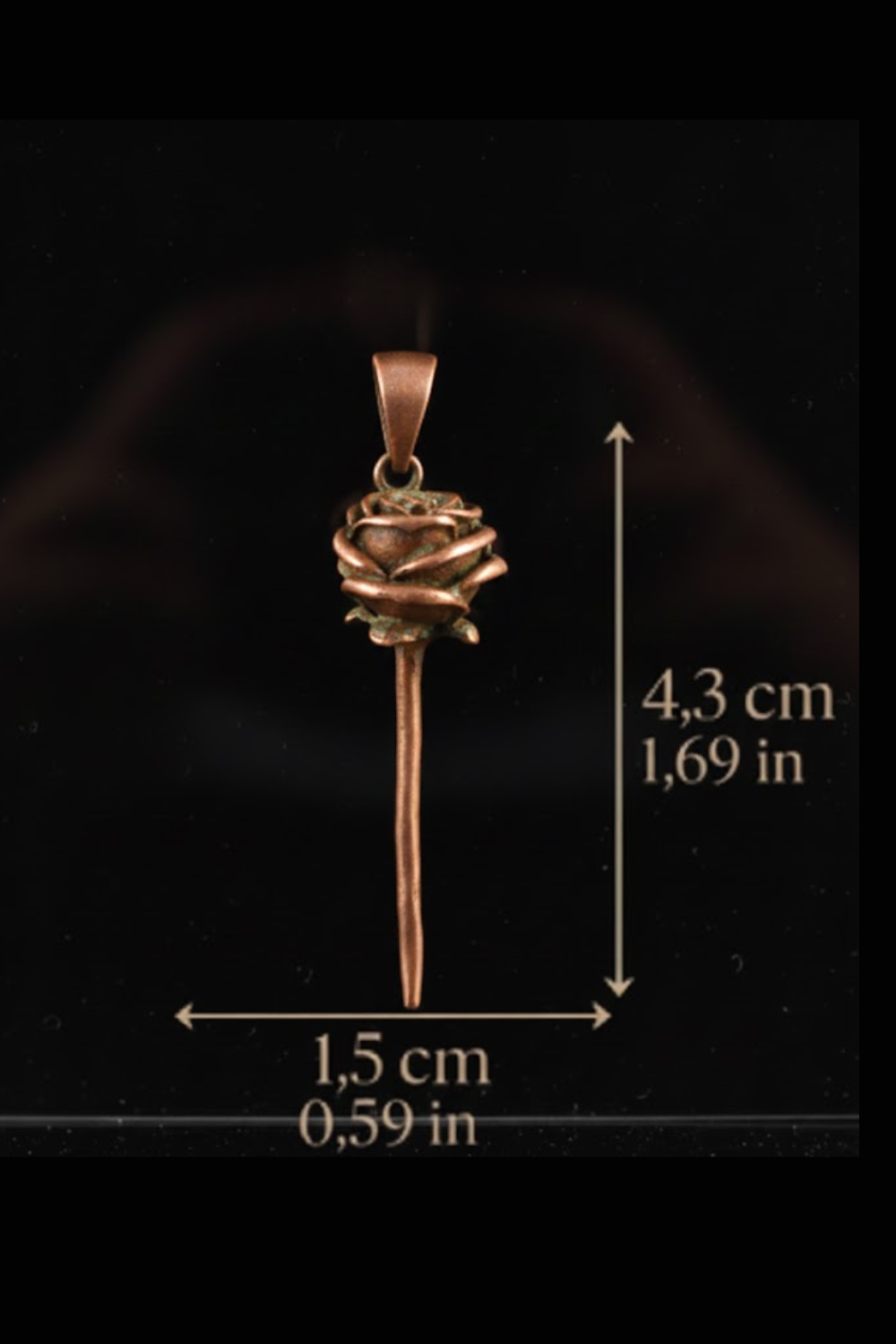 A copper-colored pendant in the shape of a rose is shown against a black background, with measurements provided.