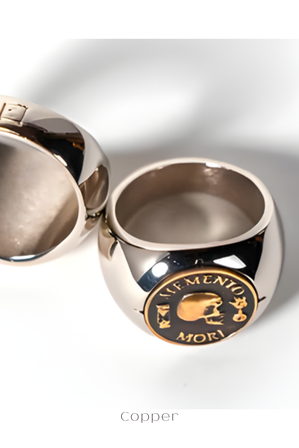 a shiny, metallic ring with a circular emblem on it.