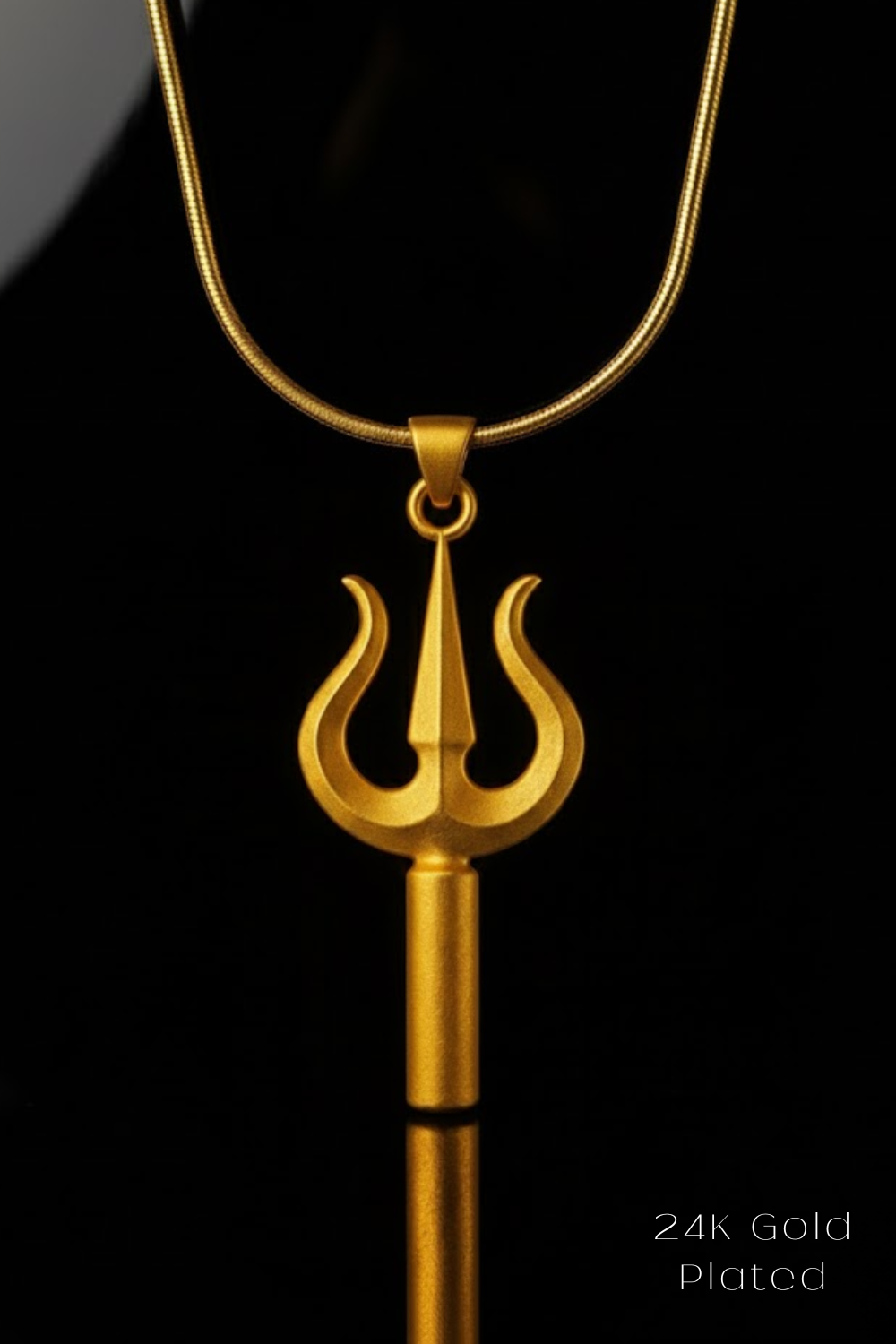 A gold-plated pendant necklace with a trident-shaped pendant against a black background.