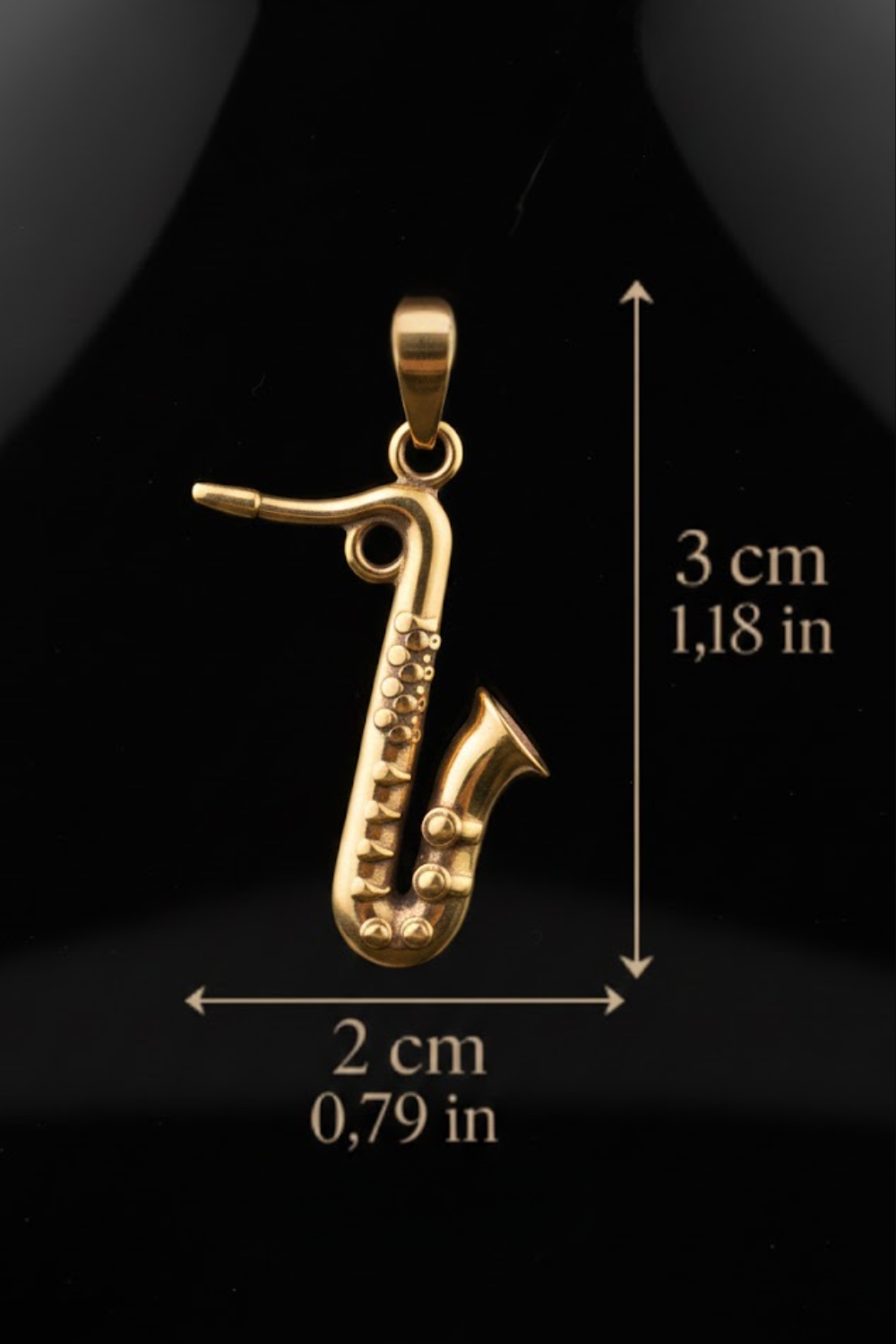 A gold-colored saxophone pendant is shown against a black background, with measurements and text indicating its size.