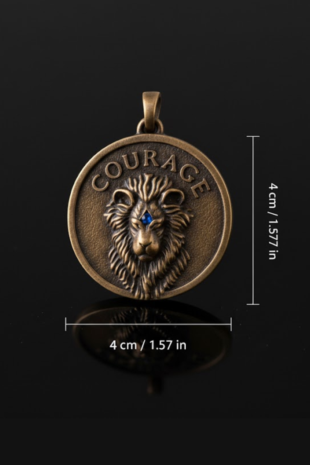 a large, round, bronze-colored pendant with a lion's head design and the word "COURAGE" inscribed on it. The pendant is shown against a black background, and there are measurements provided to indicate its size.