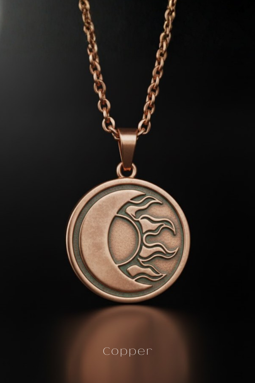 A copper-colored pendant necklace with a circular medallion featuring a crescent moon and sun design.