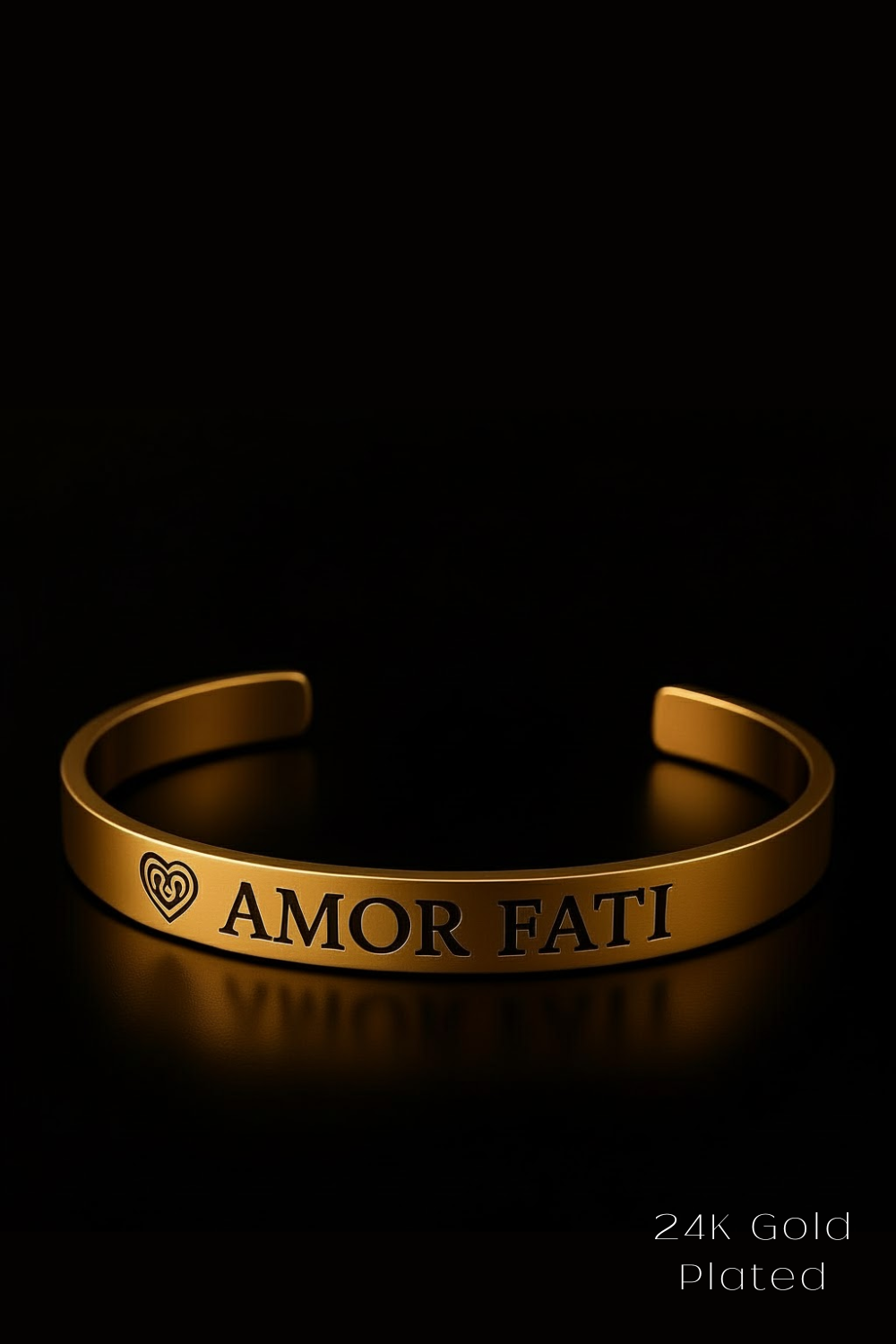 A gold bracelet with the text "AMOR Fati" engraved on it, set against a black background.