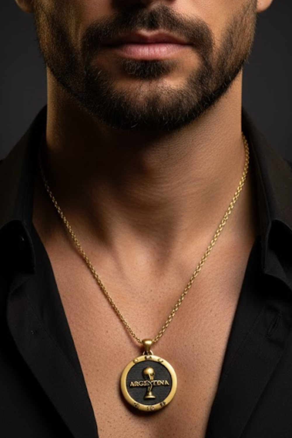 A close-up of a man's neck and chest area, with a gold-colored pendant necklace featuring a circular pendant with the text "ARGENTINA" on it.