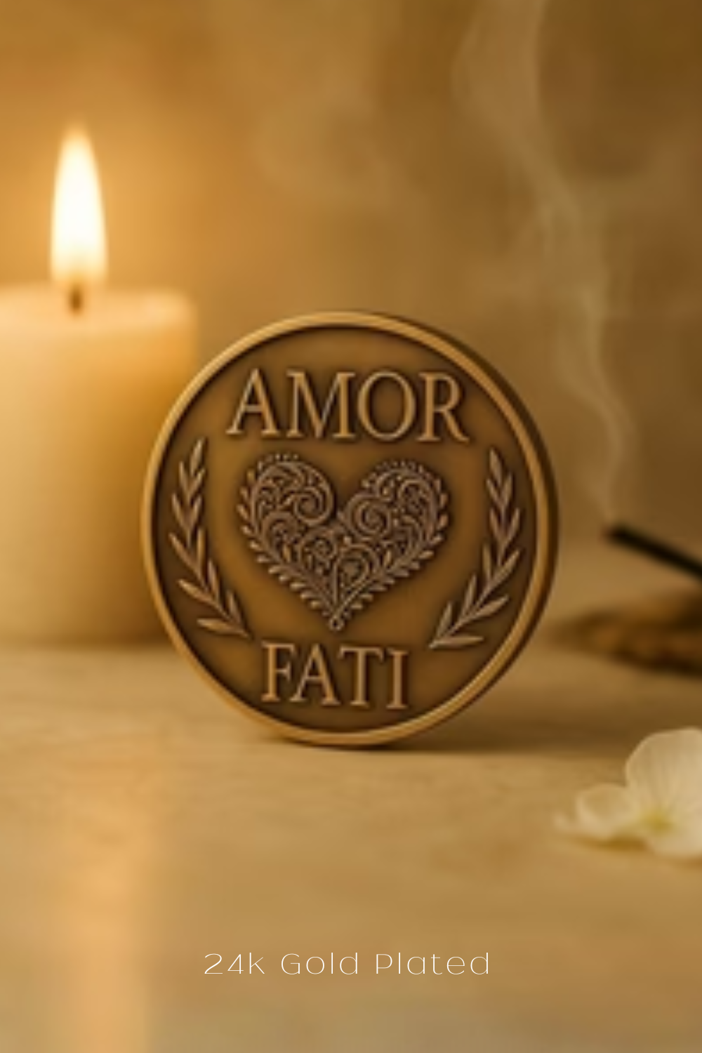 a close-up of a gold-plated coin with the words "AMOR FAMI" and a heart design, placed on a table with a lit candle and a white flower in the background.
