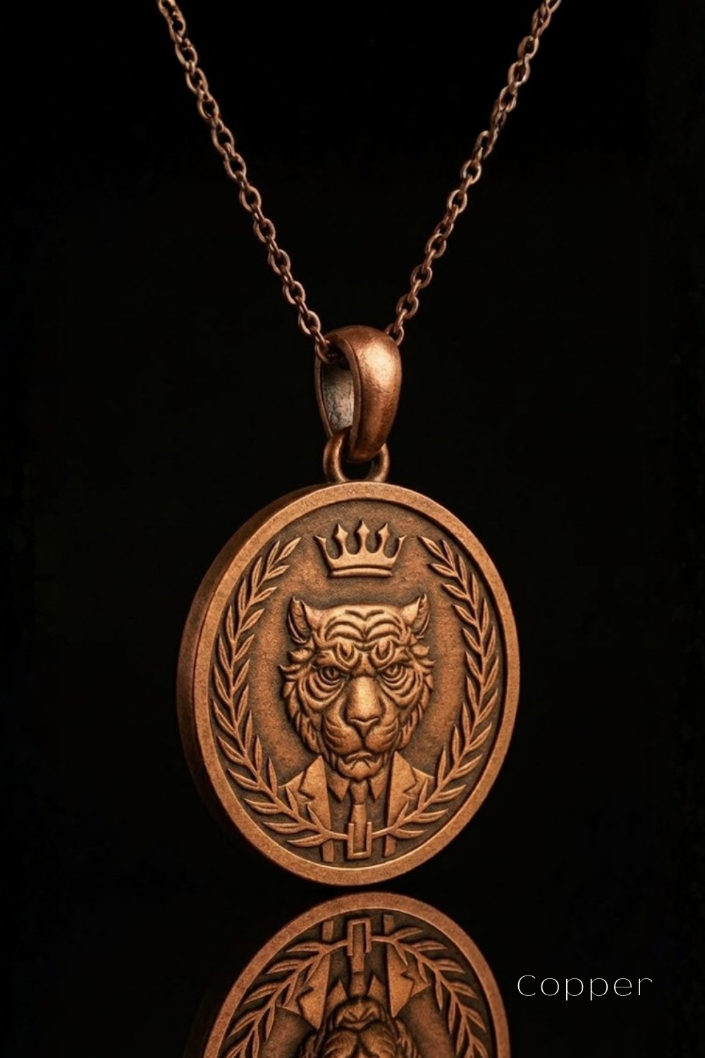 A copper-colored pendant necklace with a detailed engraved design featuring a tiger's face wearing a crown, surrounded by a laurel wreath.