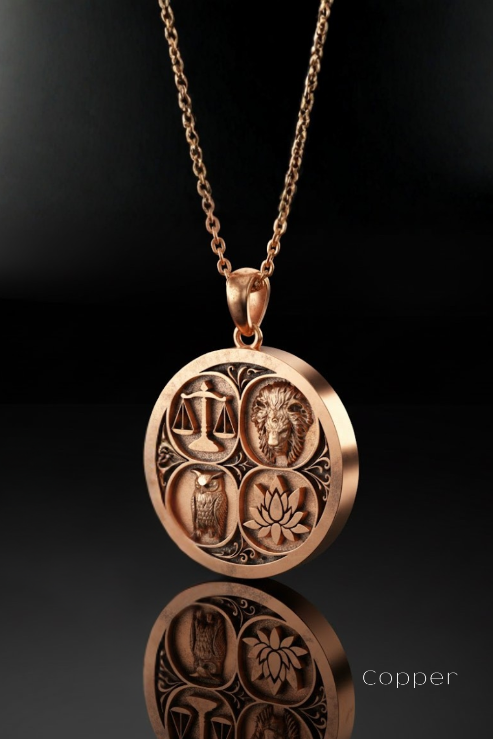 A copper-colored pendant necklace with a circular design featuring four distinct symbols: a scale, an owl, a lotus flower, and a lion.