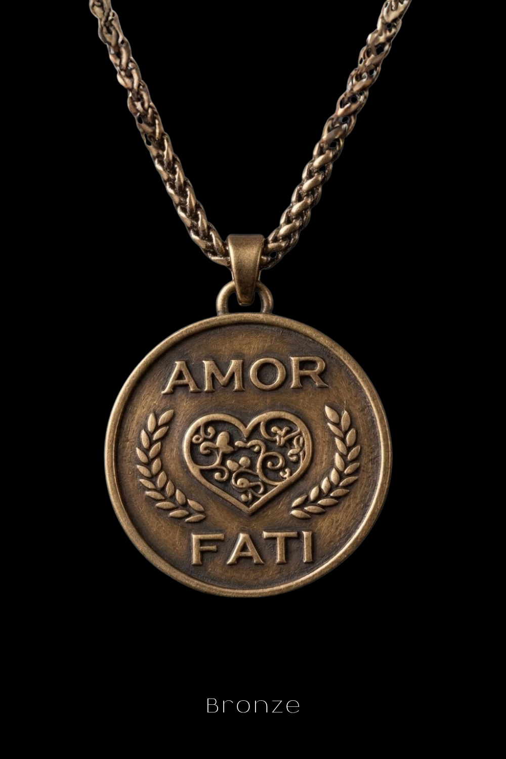 A bronze pendant necklace with a heart-shaped medallion featuring the words "Amor Fati" engraved on it.