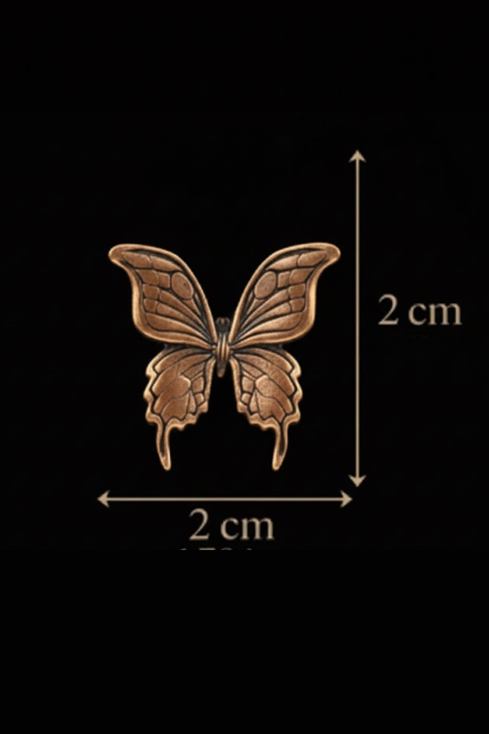 a detailed bronze butterfly with intricate patterns, measuring approximately 2 centimeters in length.