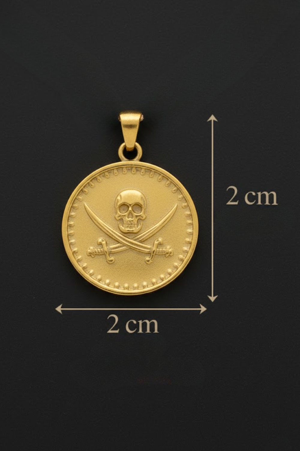 A gold-colored pendant with a skull and crossbones design, indicating it is a pirate-themed piece.