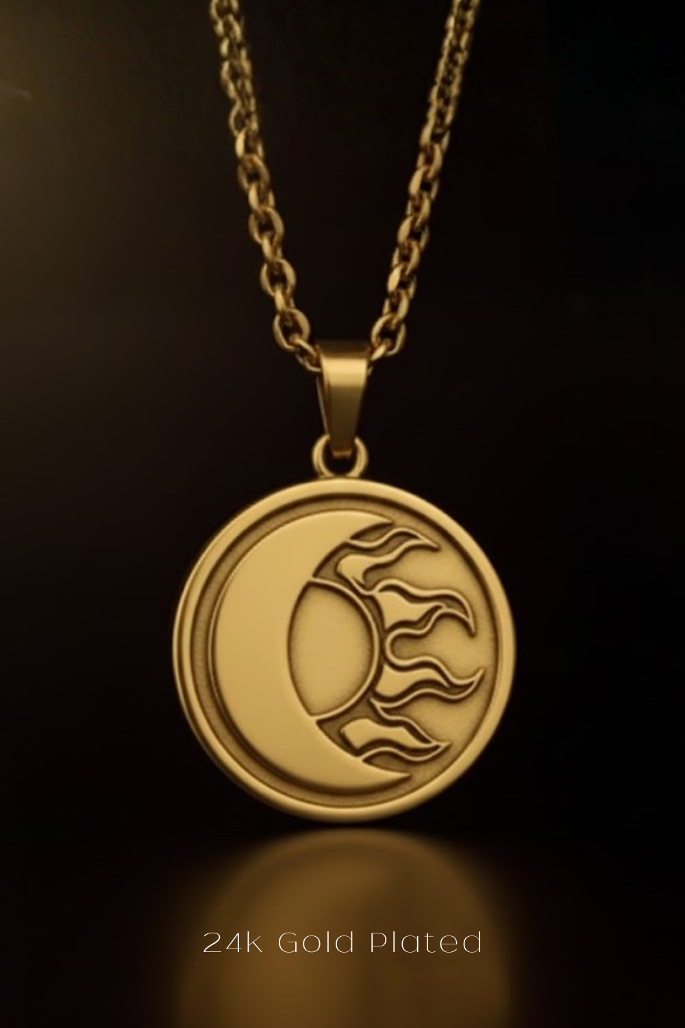 A gold-plated pendant necklace with a circular medallion featuring a crescent moon and sun design.