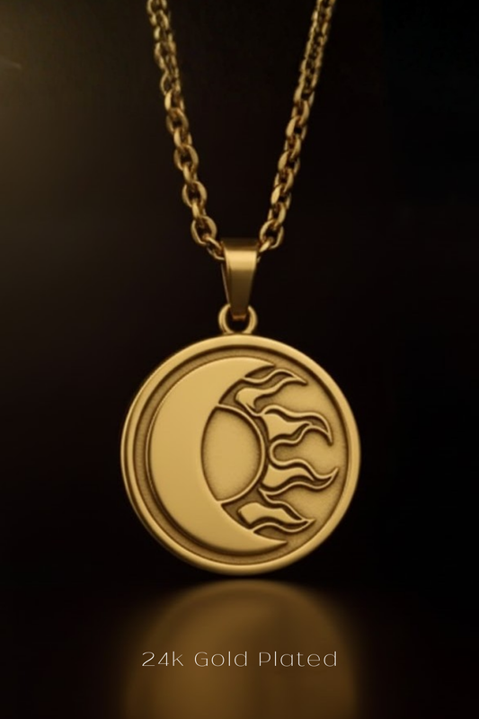 A gold-plated pendant necklace with a circular medallion featuring a crescent moon and sun design.
