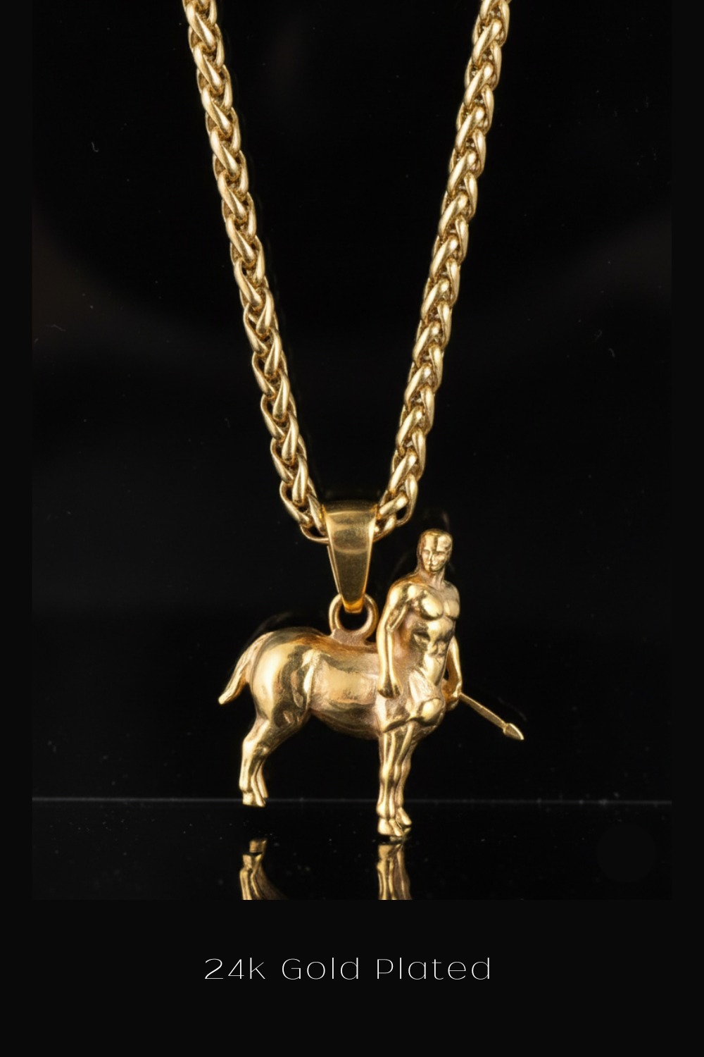 A 24k gold-plated necklace with a pendant in the shape of a man on a horse.