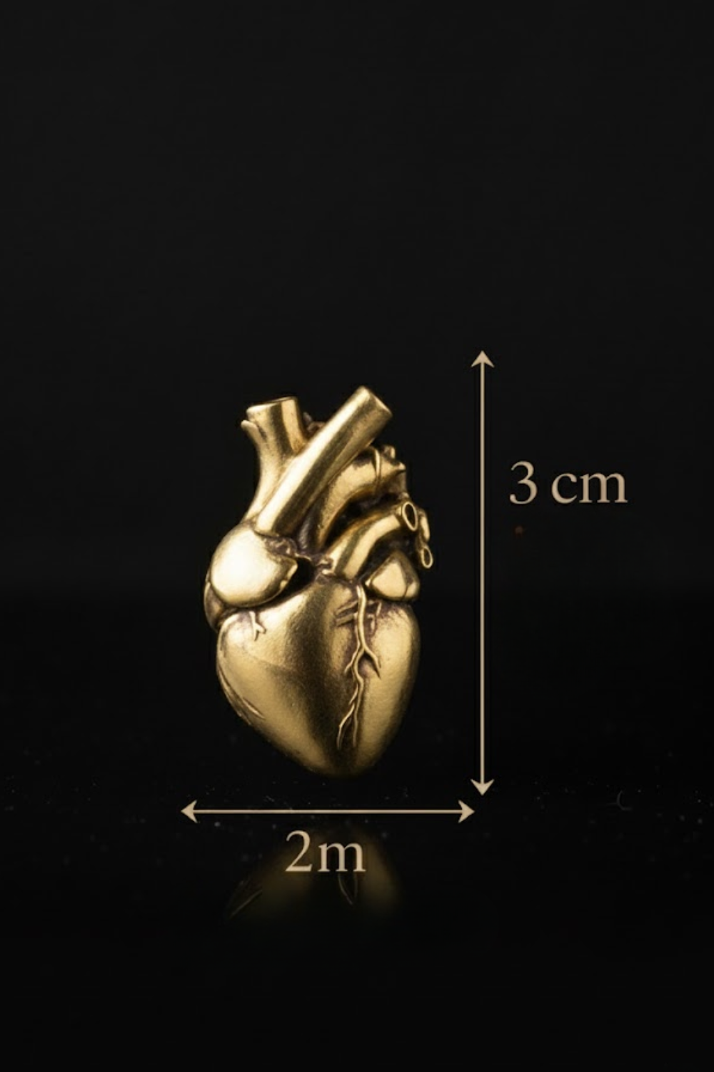 A golden heart-shaped object is shown against a black background, with measurements indicating its size.