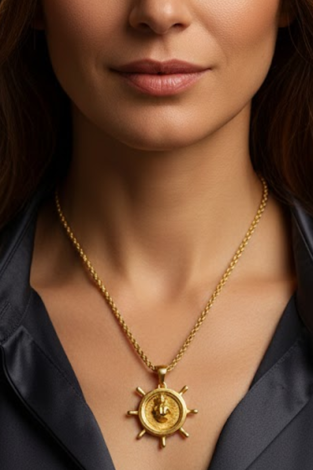 A close-up of a woman's neck and chest area, with a gold-colored pendant necklace featuring a circular medallion with a lion design.