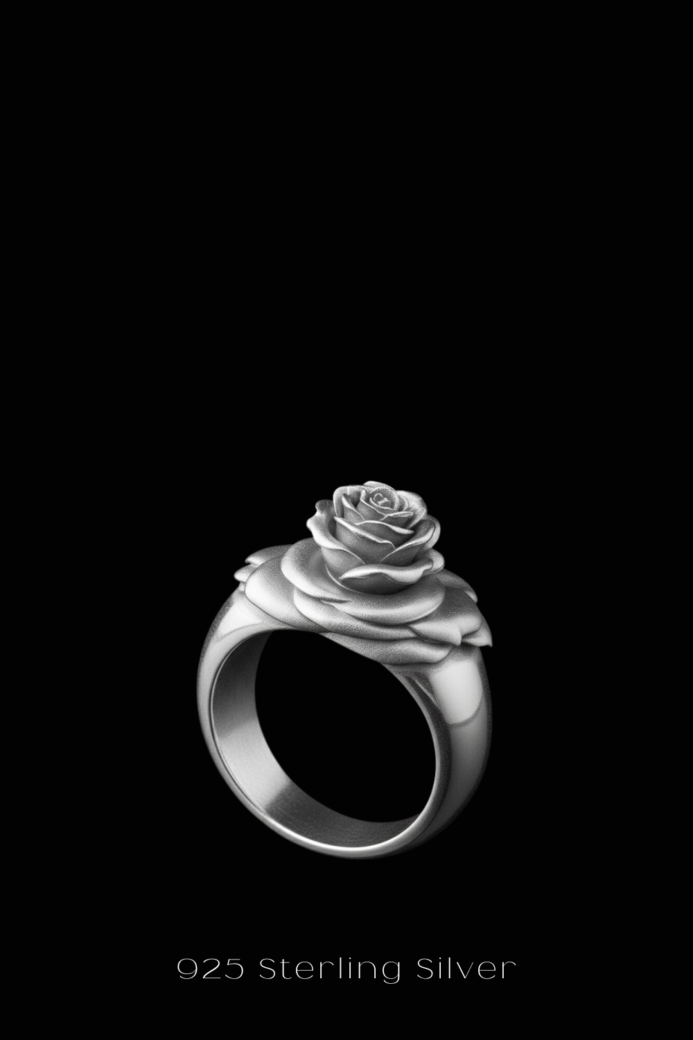 A silver ring with a rose design on it, set against a black background.