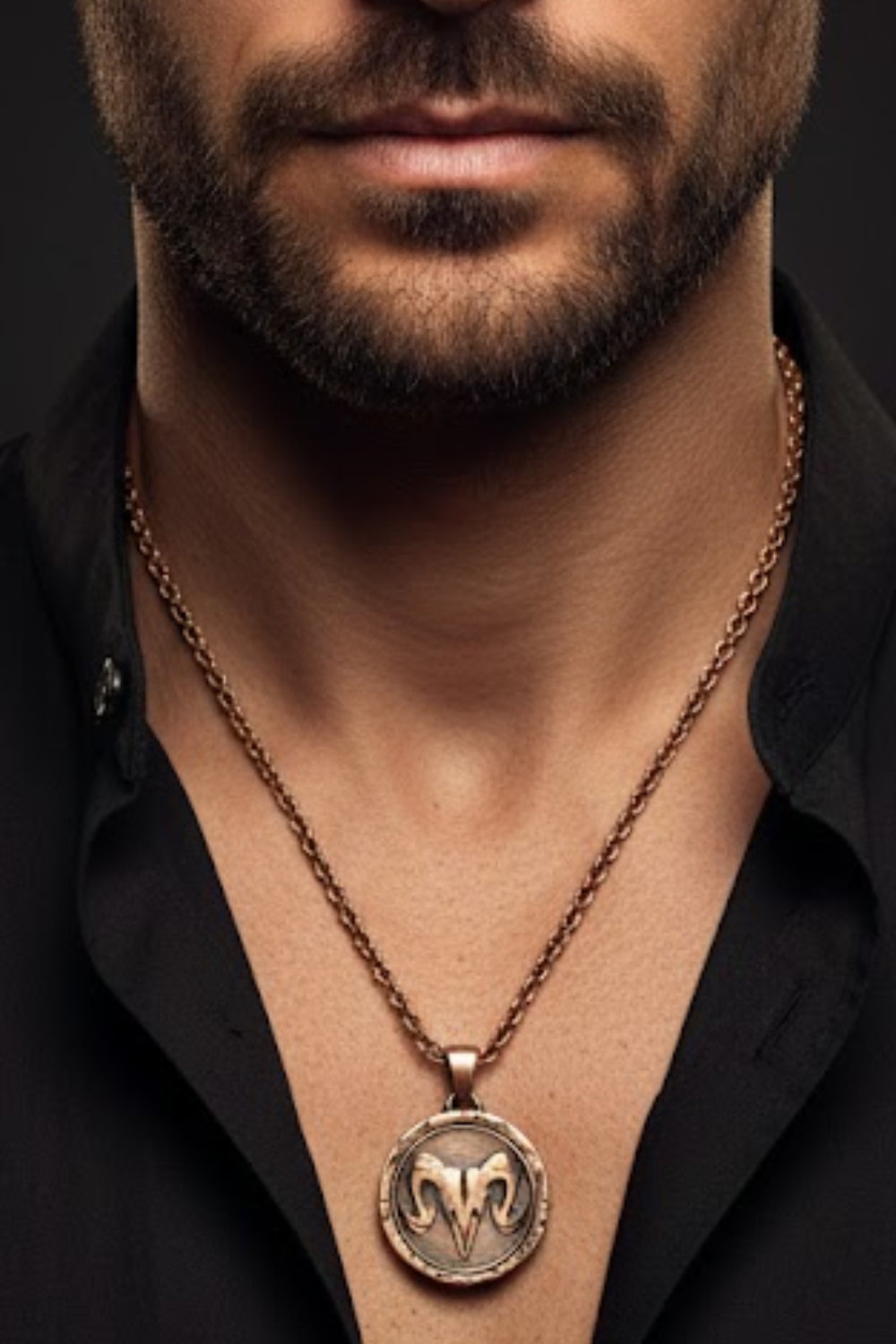 A close-up of a man's neck and chest area, with a large, ornate pendant featuring a symbol hanging from a chain around his neck.