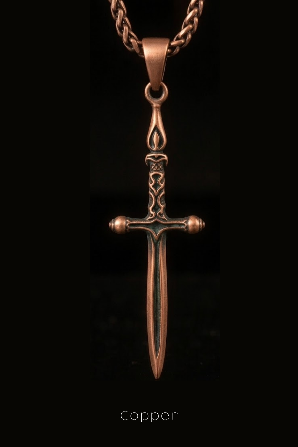 A copper-colored pendant in the shape of a sword is displayed against a black background.