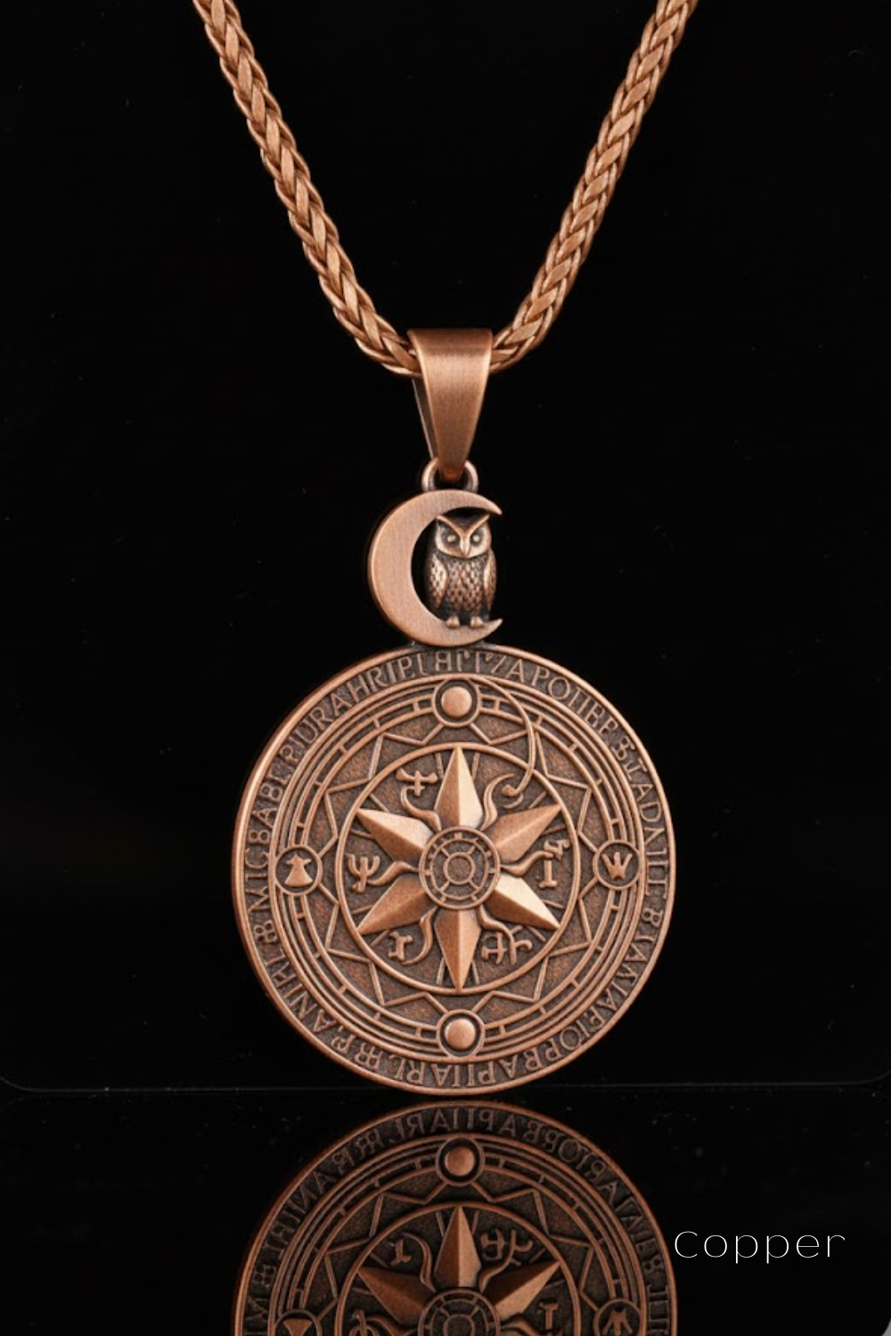 A copper-colored pendant necklace with a circular medallion featuring an owl and a crescent moon design.