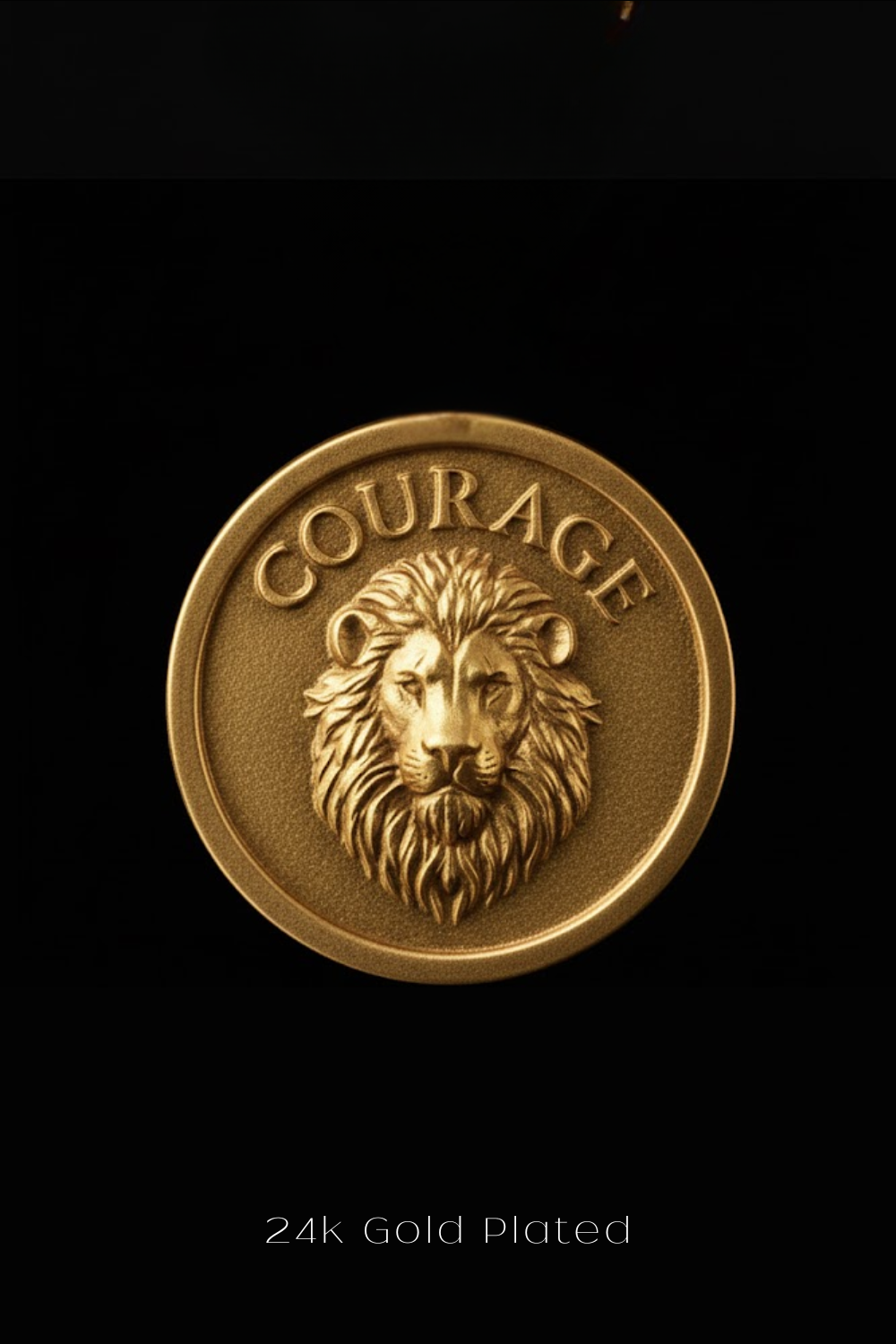 a 24k gold-plated coin with a lion's head and the word "Courage" embossed on it.