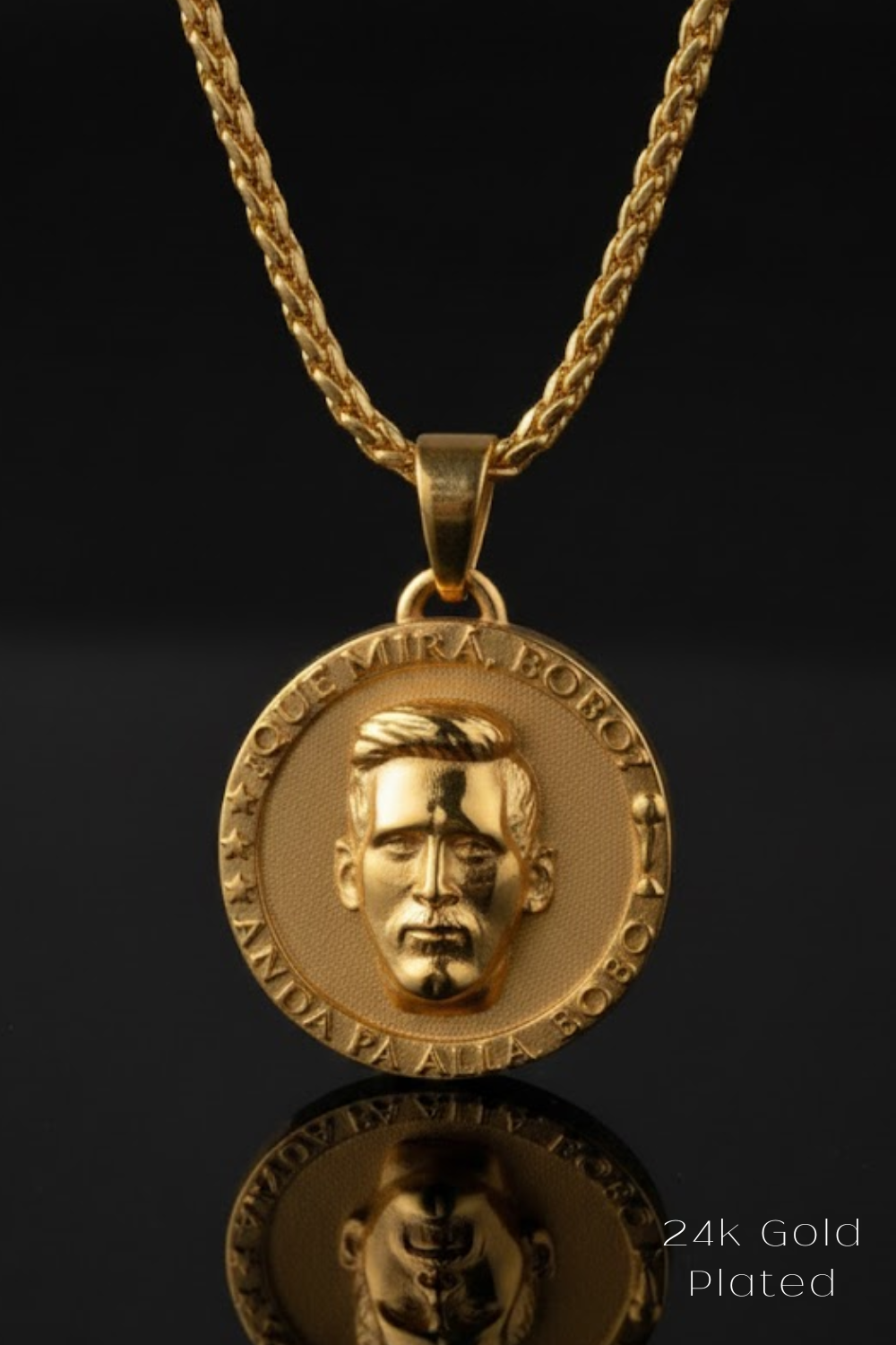 A 24k gold-plated pendant featuring a gold-plated image of a man's face on a circular medallion.