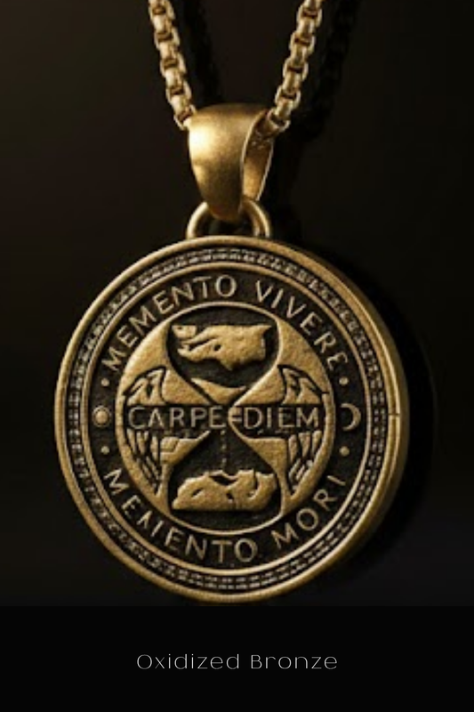 a gold-colored pendant with a circular design, including the Latin motto "Memento Vivere" and the words "Carpe Diem" and "Memento mori".