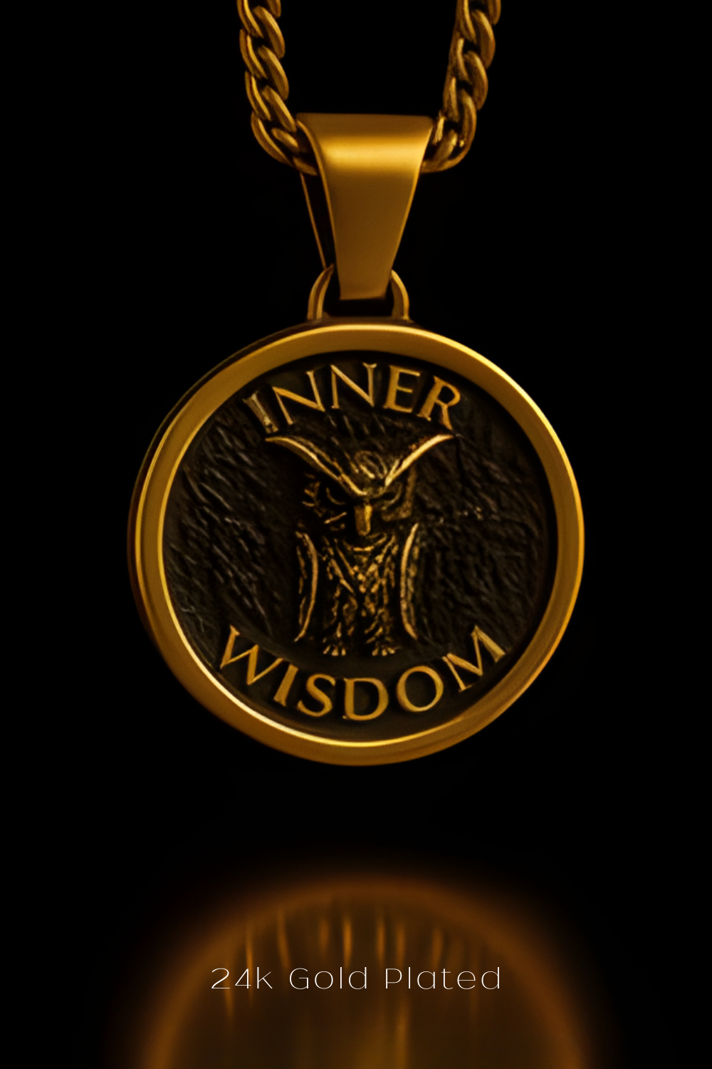 A gold-plated pendant with the text "INNER WISDOM" and an owl design, suspended from a chain against a black background.