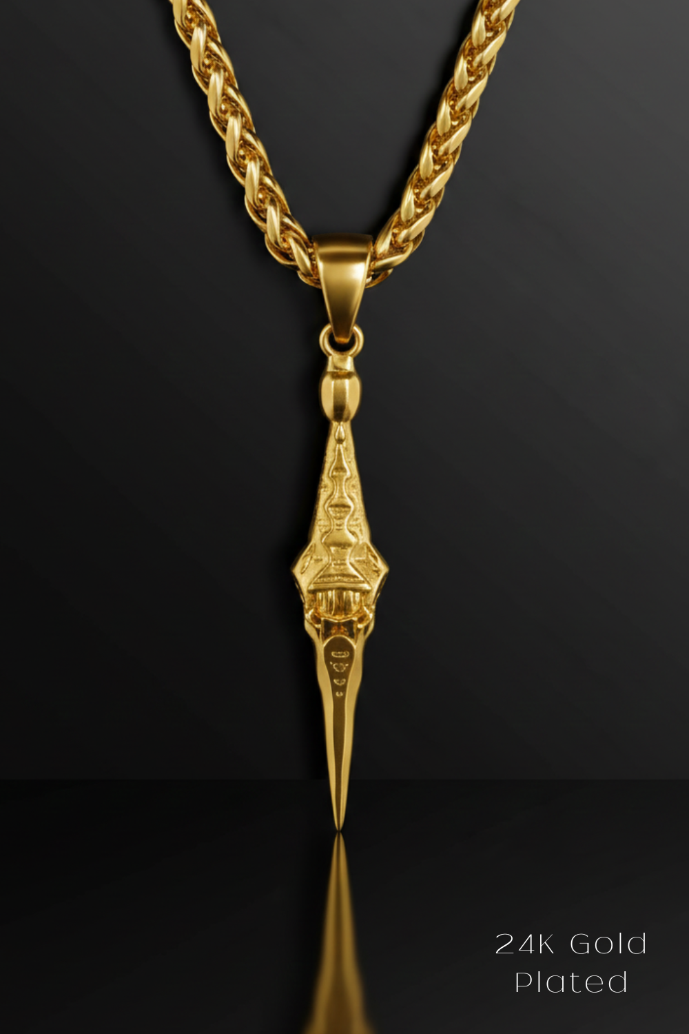 A 24K gold plated pendant with a chain is displayed against a black background.