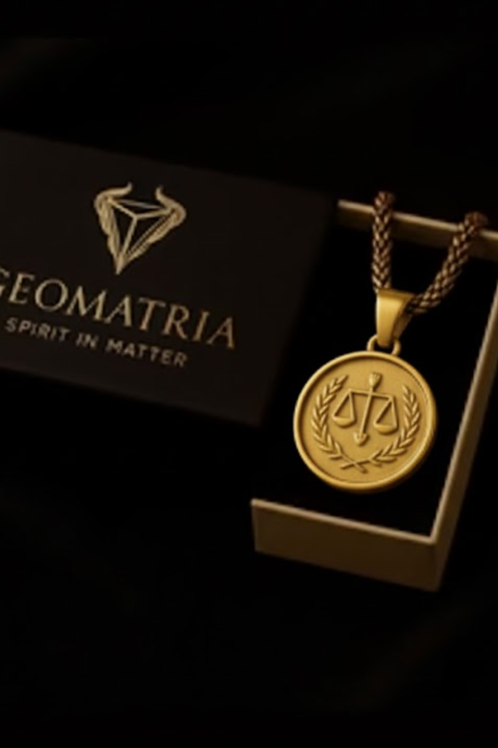 a gold-colored pendant with a circular emblem, placed on a black background.