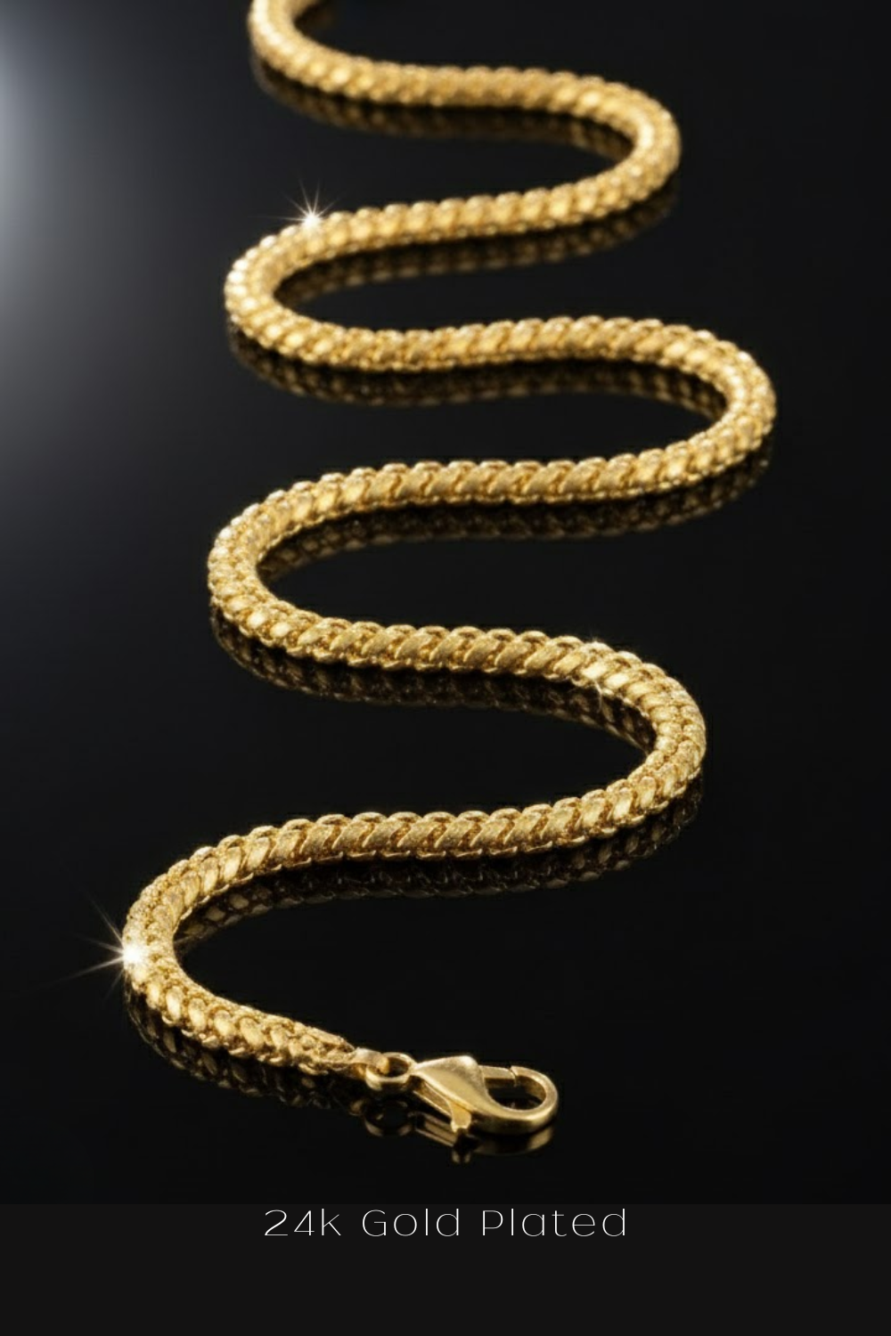 A 24k gold plated chain necklace with a shiny, reflective design is shown against a black background.