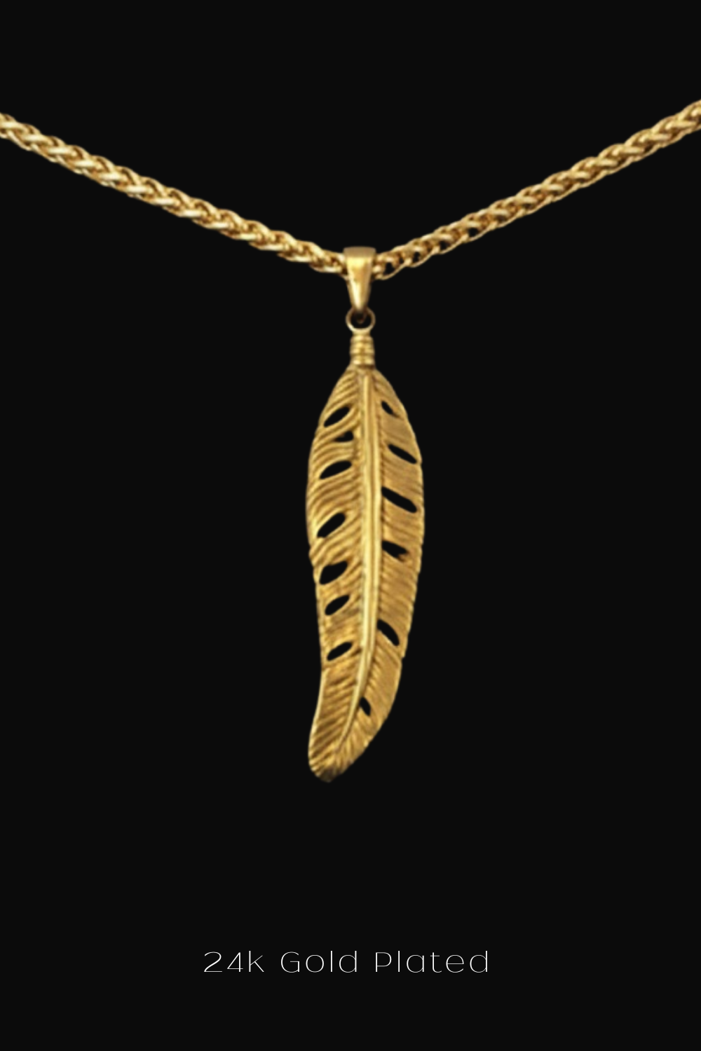A 24k gold plated feather pendant necklace against a black background.