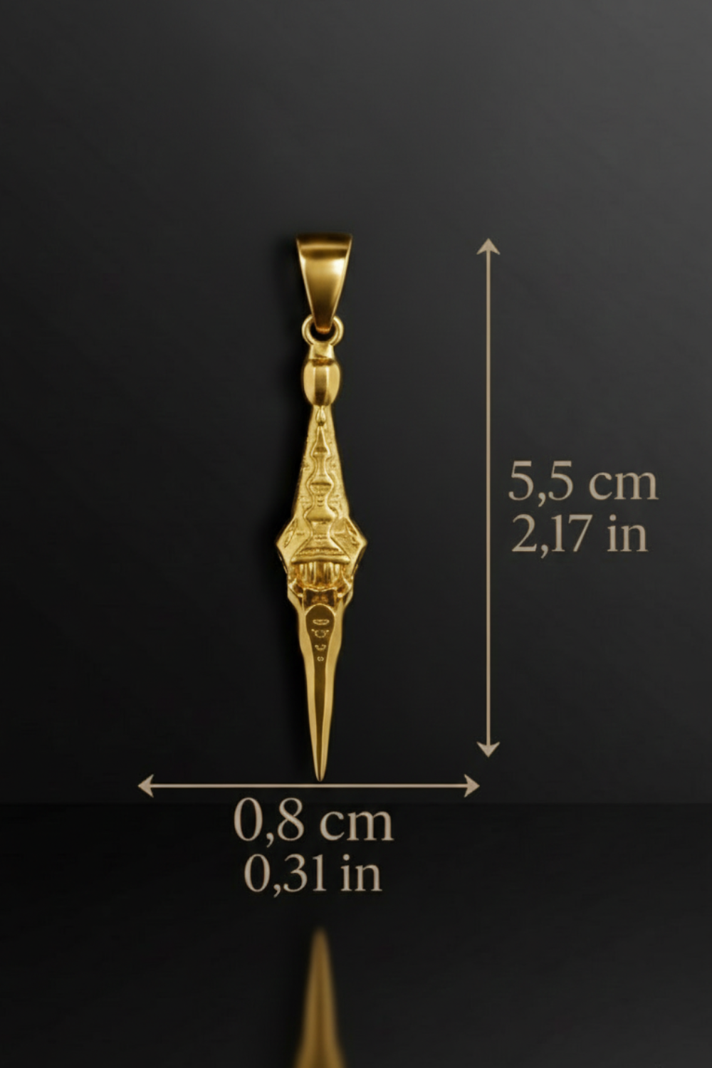 A gold pendant with a pointed design is shown against a black background, accompanied by measurements indicating its size.