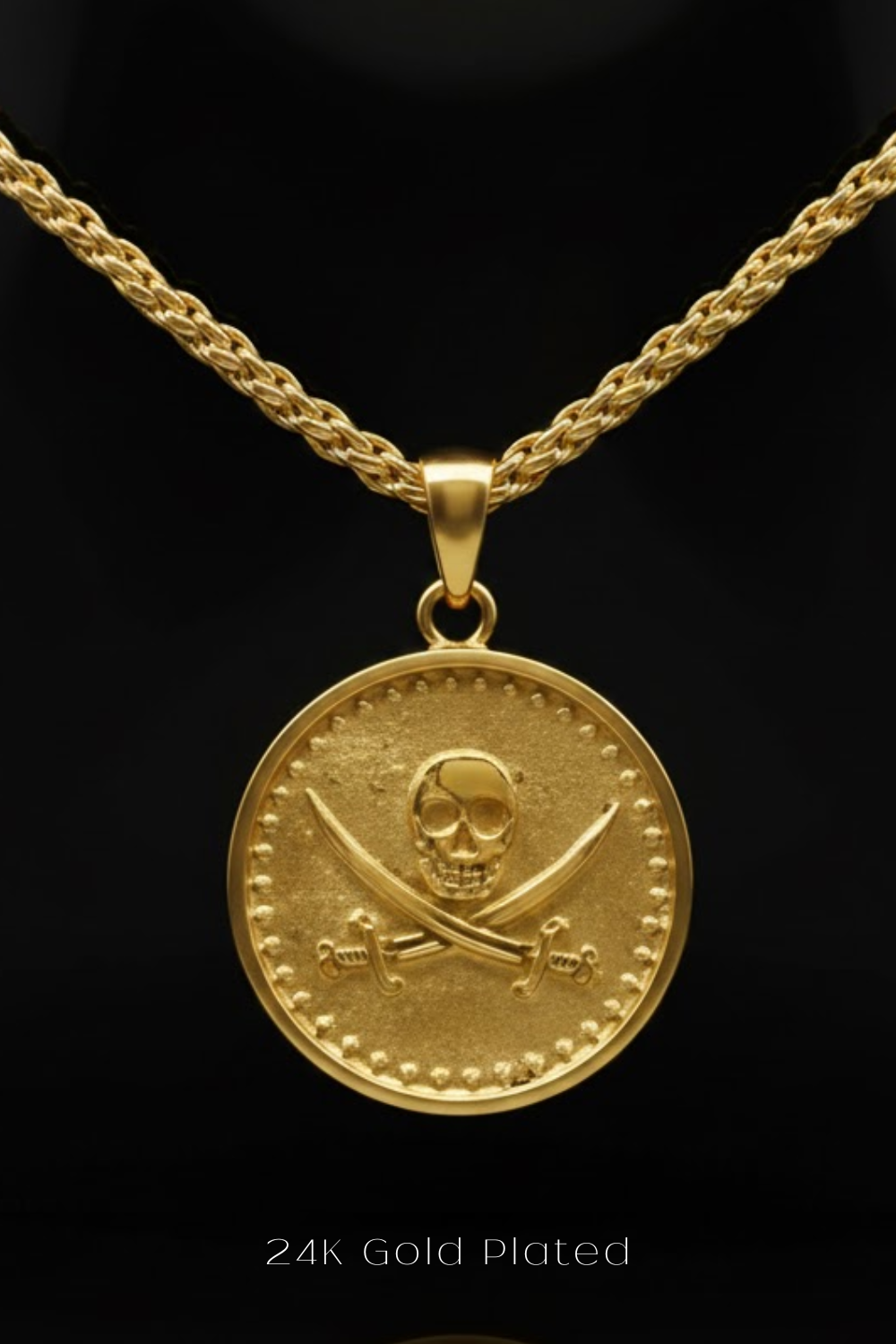 A gold-plated pendant featuring a skull and crossbones design on a circular medallion.
