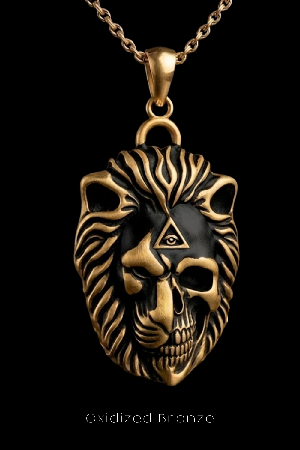A gold-colored pendant in the shape of a lion's head with a skull design, suspended from a chain.