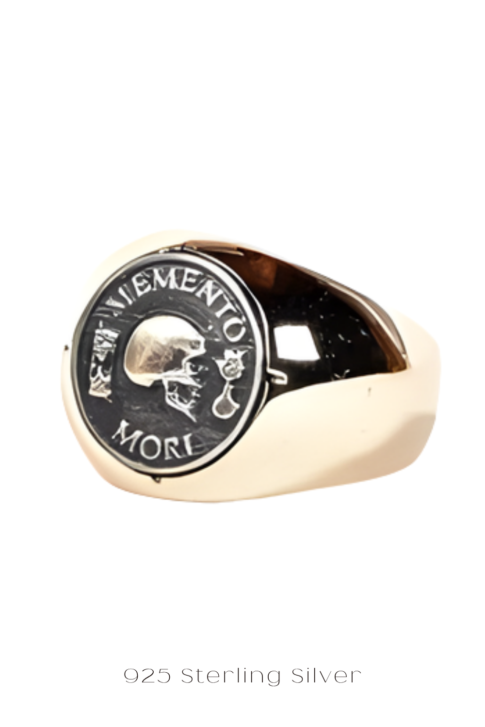 A gold ring with a black and white engraved design featuring a skull and the text "MORI" on it.