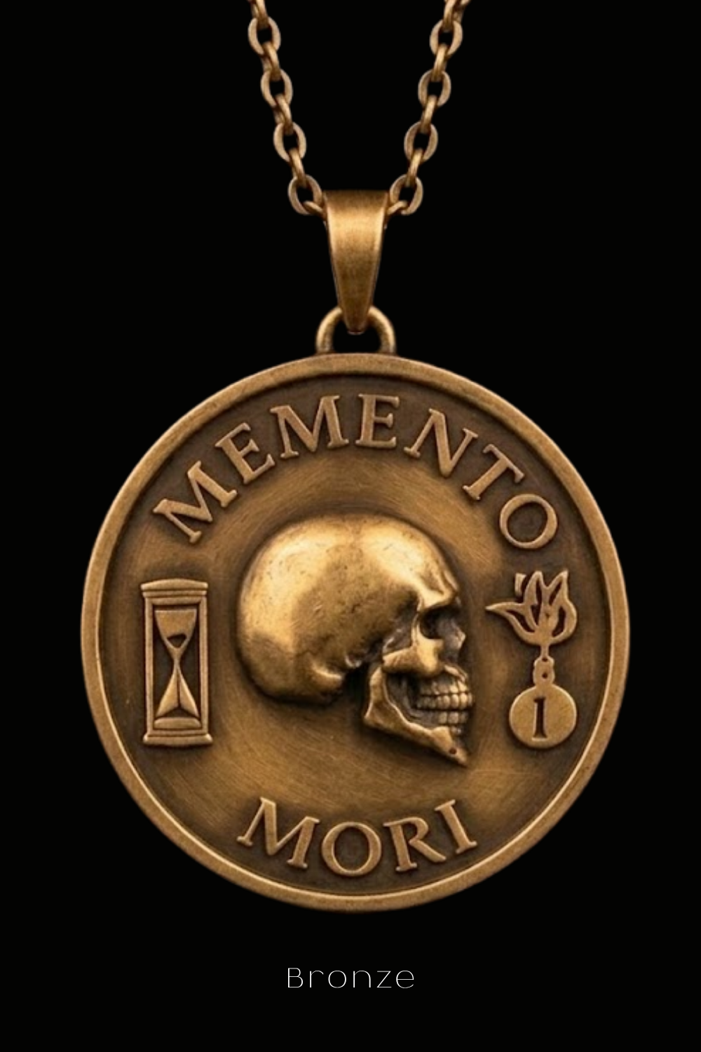 A bronze pendant necklace with the text "MEMENTO MORI" and a skull design.